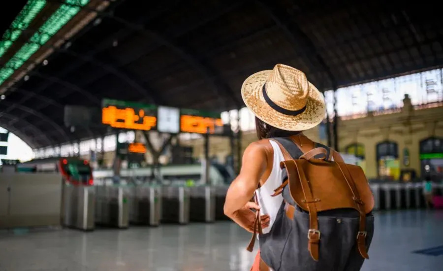 woman traveling solo in train station