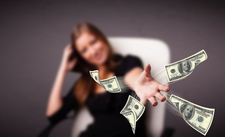 woman throwing money