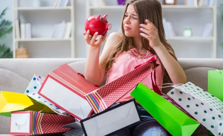 woman looking at her purchases unhappy