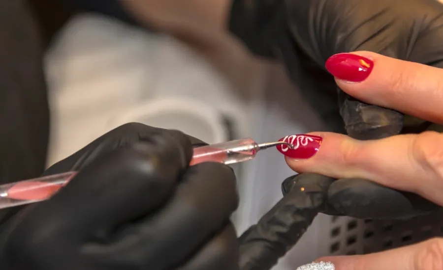 nail technician filing nails
